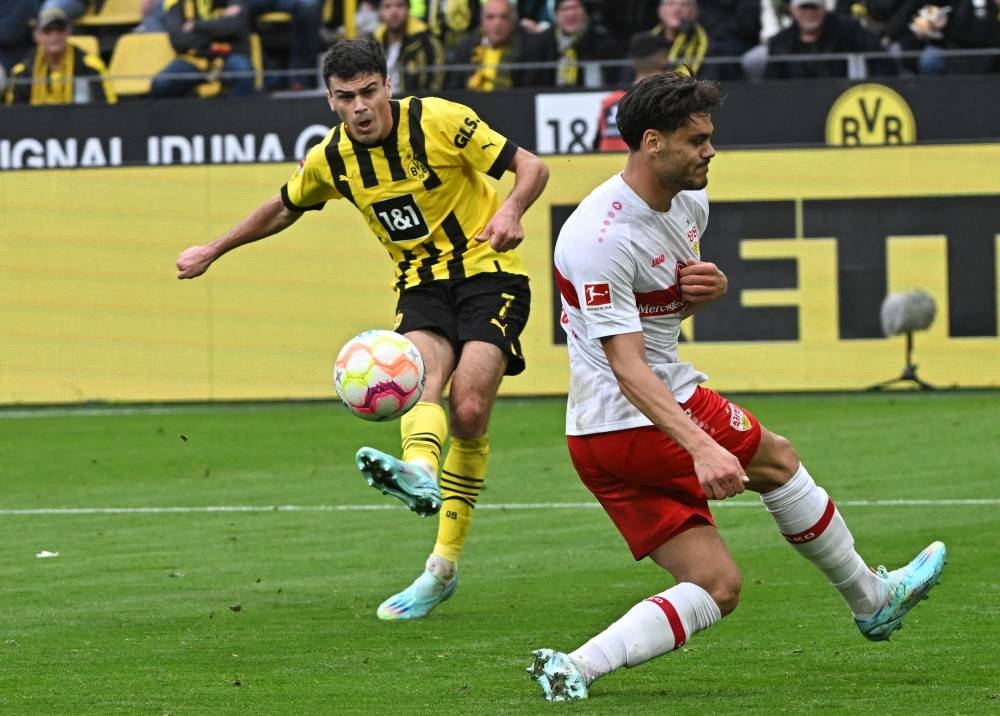 Borussia Dortmund's Giovanni Reyna scores their third goal in the match against VfB Stuttgart. — Reuters pic 