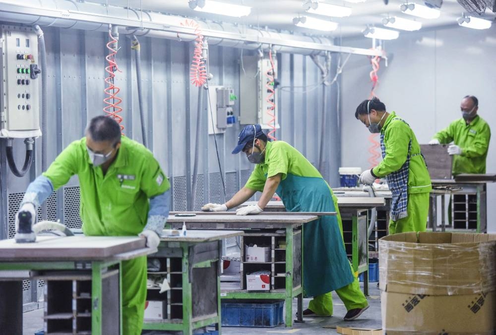 Workers produce furniture at a factory in Hangzhou in China’s eastern Zhejiang province, October 24, 2022. — AFP pic 