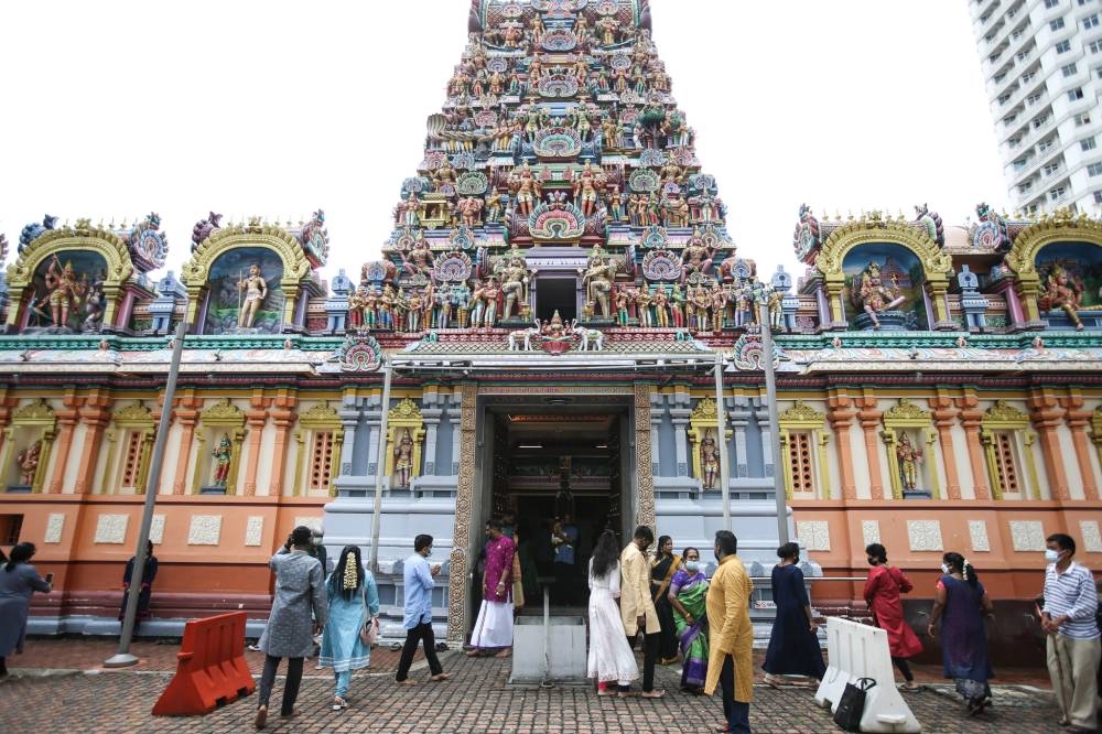 Hindu devotees offer a prayer during Deepavali festival at Sri Kandaswamy Temple in Brickfields October 24, 2022. — Picture by Ahmad Zamzahuri