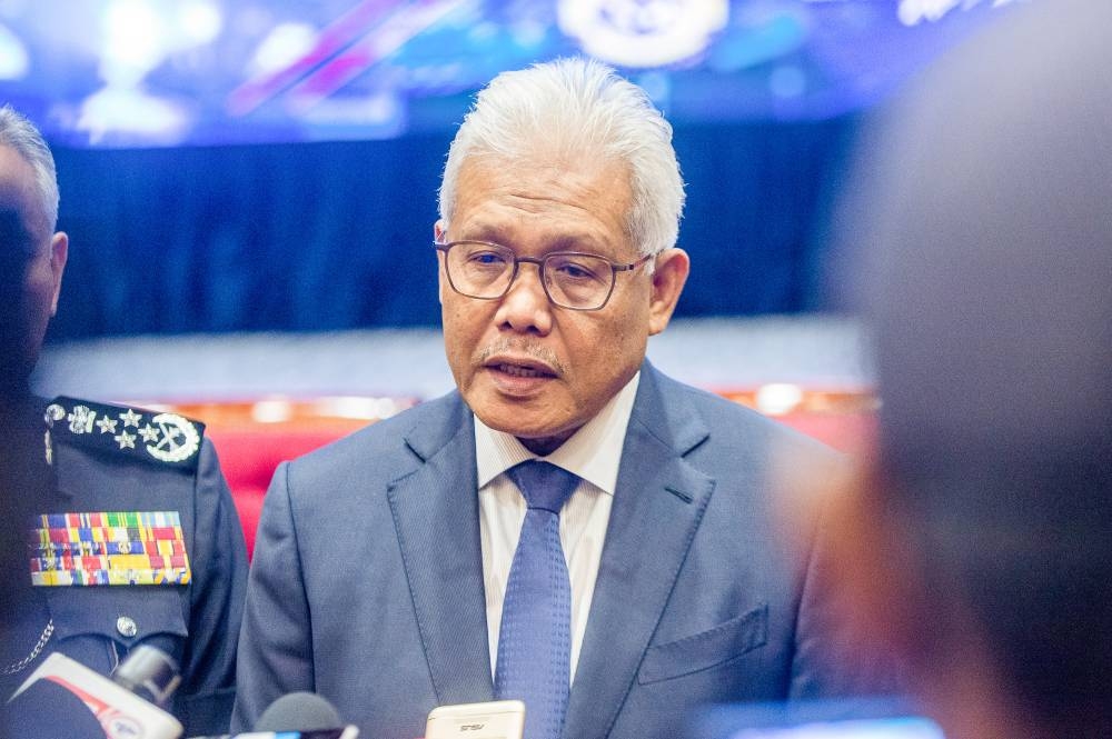 Caretaker Home Minister Datuk Seri Hamzah Zainudin speaks to reporters during the opening of the National Forensic Science Symposium for Law Enforcement at PDRM College in Cheras, October 26, 2022. — Picture by Shafwan Zaidon