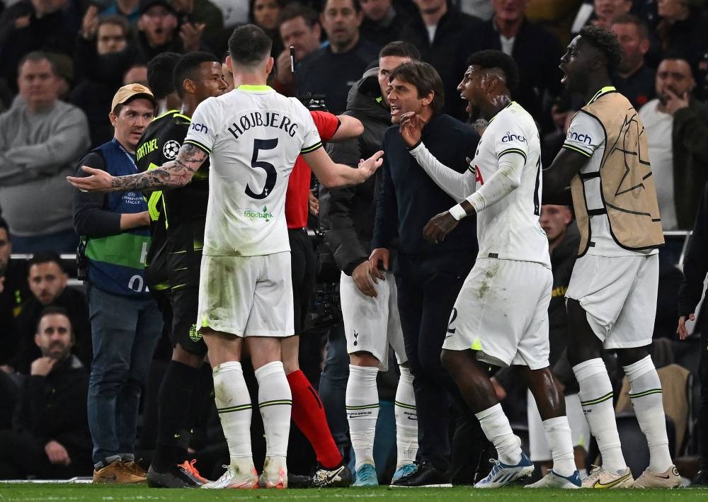 Tottenham Hotspur head coach Antonio Conte reacts after being shown a red card by Dutch referee Danny Makkelie (obscured) after a disallowed goal in the closing minutes of the Uefa Champions League group D match between Tottenham Hotspur and Sporting Lisbon at the Tottenham Hotspur Stadium in London, October 26, 2022. — AFP pic 