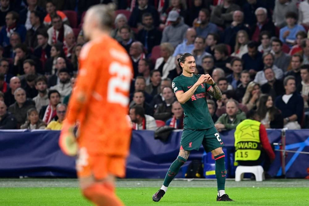 Liverpool striker Darwin Nunez celebrates scoring his team’s second goal during the Uefa Champions League group A match between Ajax Amsterdam and Liverpool at the Johan Cruijff Arena in Amsterdam, October 26, 2022. — AFP pic 