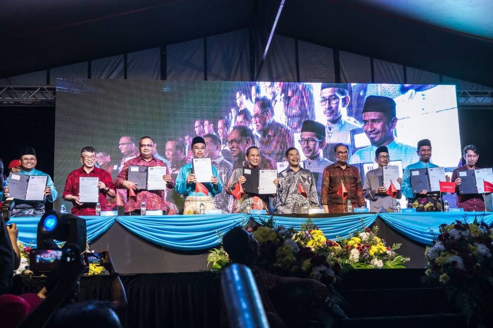 PKR candidates pose for a group photo during a rally to announce the party’s candidates ahead of the 15th upcoming general election at Padang MPAJ Taman Kosas in Ampang, October 28, 2022. — Picture by Firdaus Latif