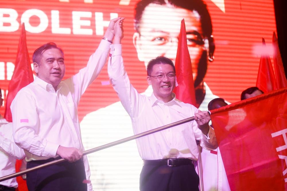 DAP secretary-general Loke Siew Fook and Perak DAP chairperson Nga Kor Ming arrived at Perak DAP’s candidacy announcement programme at Kinta Riverfront Hotel in Ipoh. — Picture by Farhan Najib