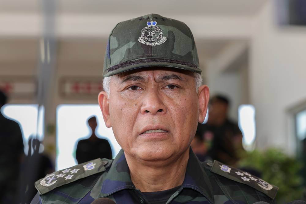 Inspector-General of Police Tan Sri Acryl Sani Abdullah Sani speaks to the media after the closing ceremony of the GOF Central Brigade’s Tiger Platoon Unit basic training at the GOF 6th Batallion Camp in Johor, October 30, 2022. — Bernama pic 