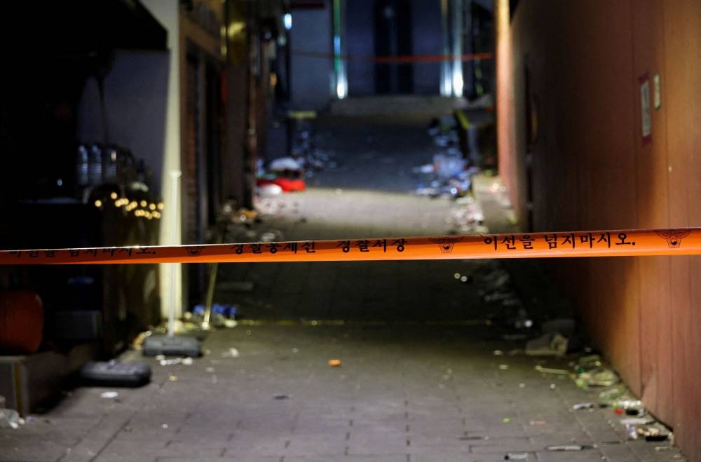 Police tape marks the site of a crowd crush that happened during Halloween festivities in Seoul, South Korea, November 2, 2022. — Reuters pic