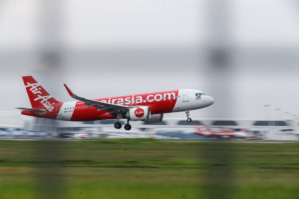 An AirAsia plane iss seen landing as it arrives at the Kuala Lumpur International Airport (KLIA) November 21, 2022. — Picture by Sayuti Zainudin