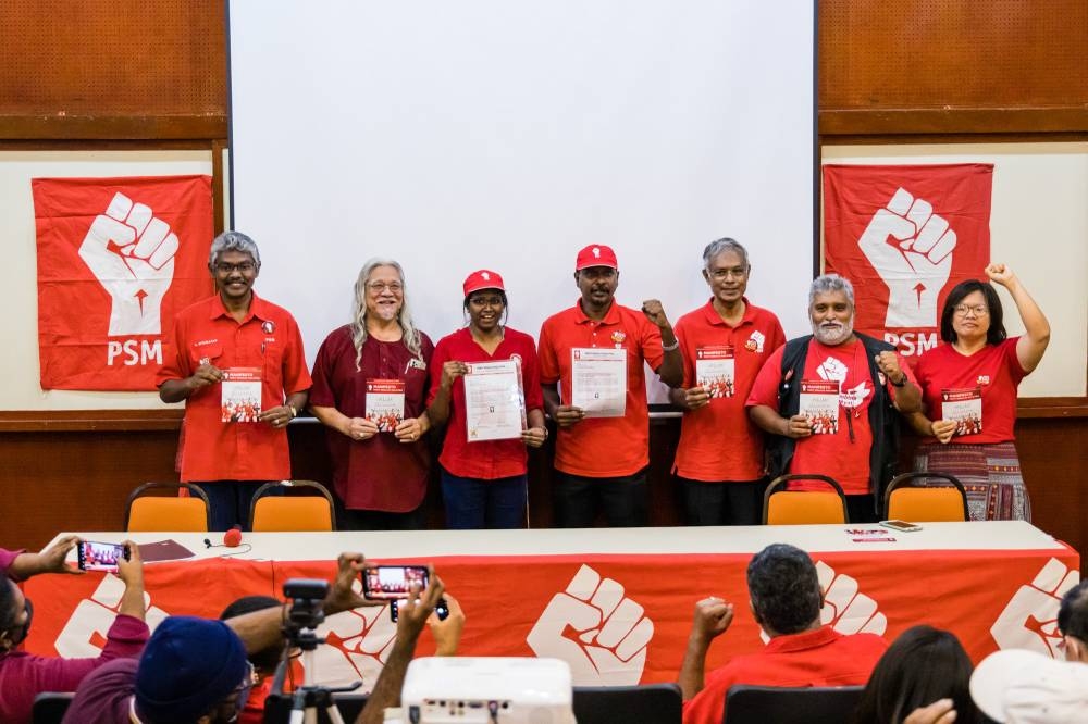 KS Bawani (3rd left) and Tinagaran Subramaniam (4rd right) and other candidates during the announcement of Parti Sosialis Malaysia (PSM) GE15 line-up in Kuala Lumpur, November 2, 2022. — Picture by Firdaus Latif