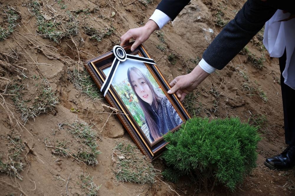 A portrait of Jung Joo-hee, 30, who were one of the victims of a crowd crush that happened during Halloween festivities, is placed at her grave in Namyangju, South Korea, November 3, 2022. — Reuters pic