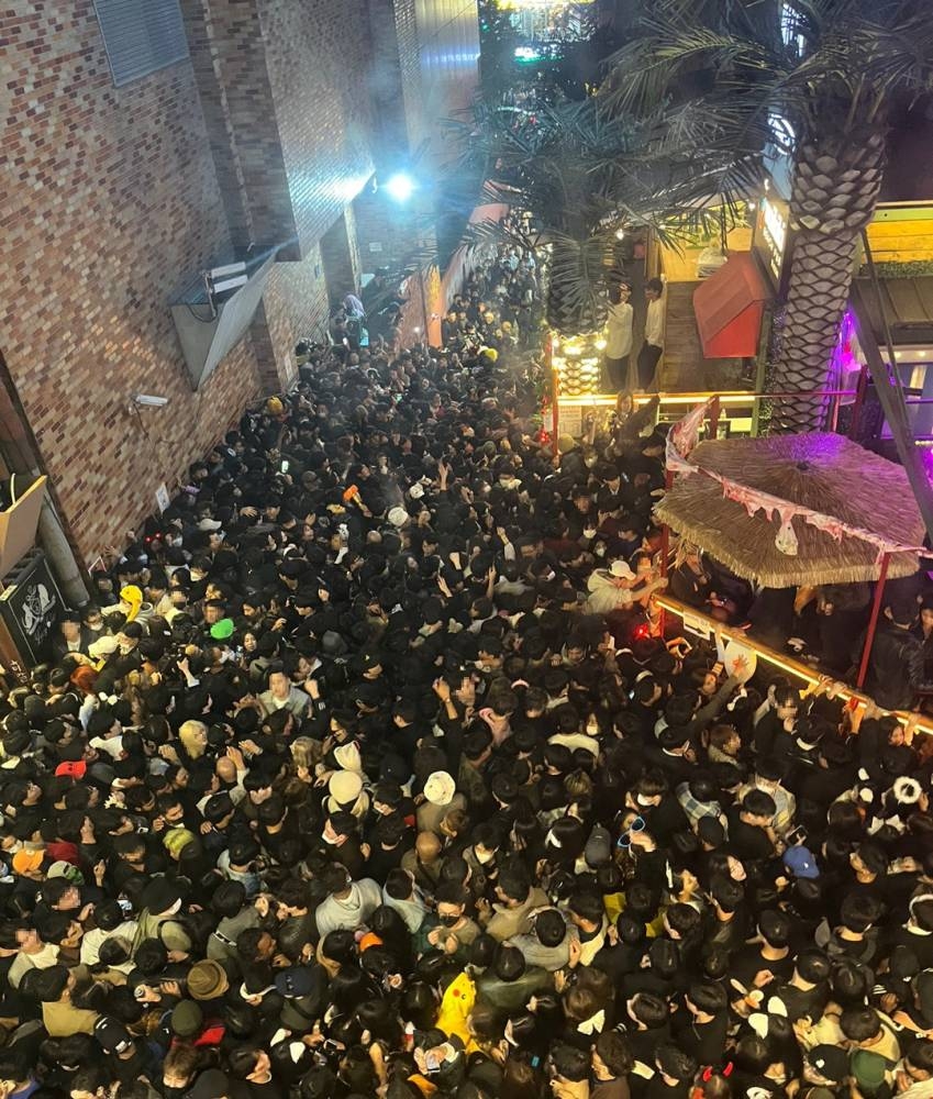 A street in Itaewon district is pictured full of people before a stampede during Halloween festivities killed and injured many in Seoul, South Korea, in this image released by Yonhap on October 30, 2022. — Yonhap pic via Reuters