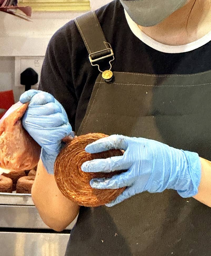 At KLCG Bakery & Confectionery, you can see how they fill the pastry discs with various ganache and curd flavours.