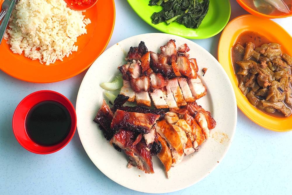 Lunch on an assortment of BBQ meats from pork ribs, 'char siu', roast pork and chicken at this stall located at Jalan Bedara. — Pictures by Lee Khang Yi