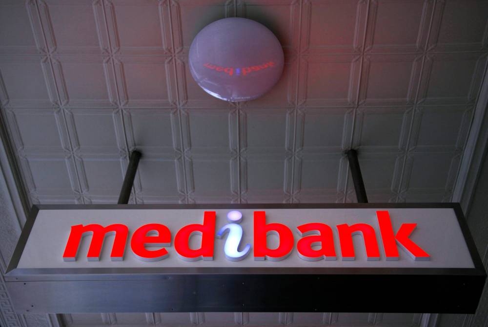 An illuminated sign is seen outside a branch of the Australian health insurer Medibank Private in Sydney October 20, 2014. — Reuters pic