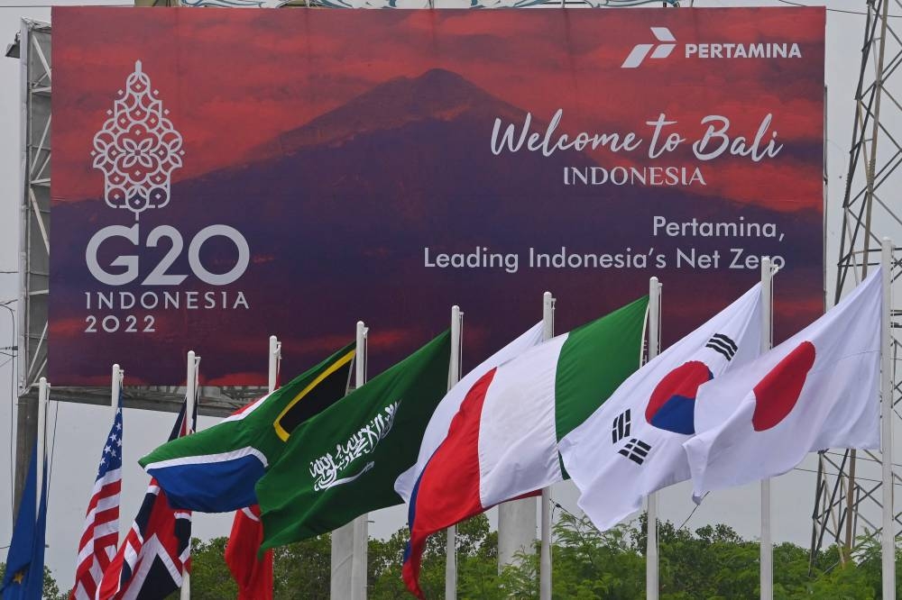 The flags of G20 member nations are flown ahead of the G20 Summit in Nusa Dua, Bali island on November 13, 2022. — AFP pic