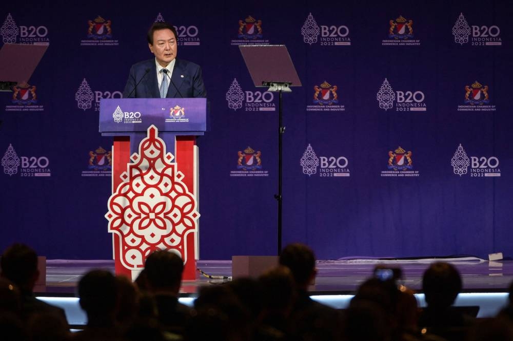 South Korea's President Yoon Suk-Yeol delivers a speech during the B20 Summit as part of the G20 dialogue in Nusa Dua on the Indonesian resort island of Bali on November 14, 2022. — AFP pic