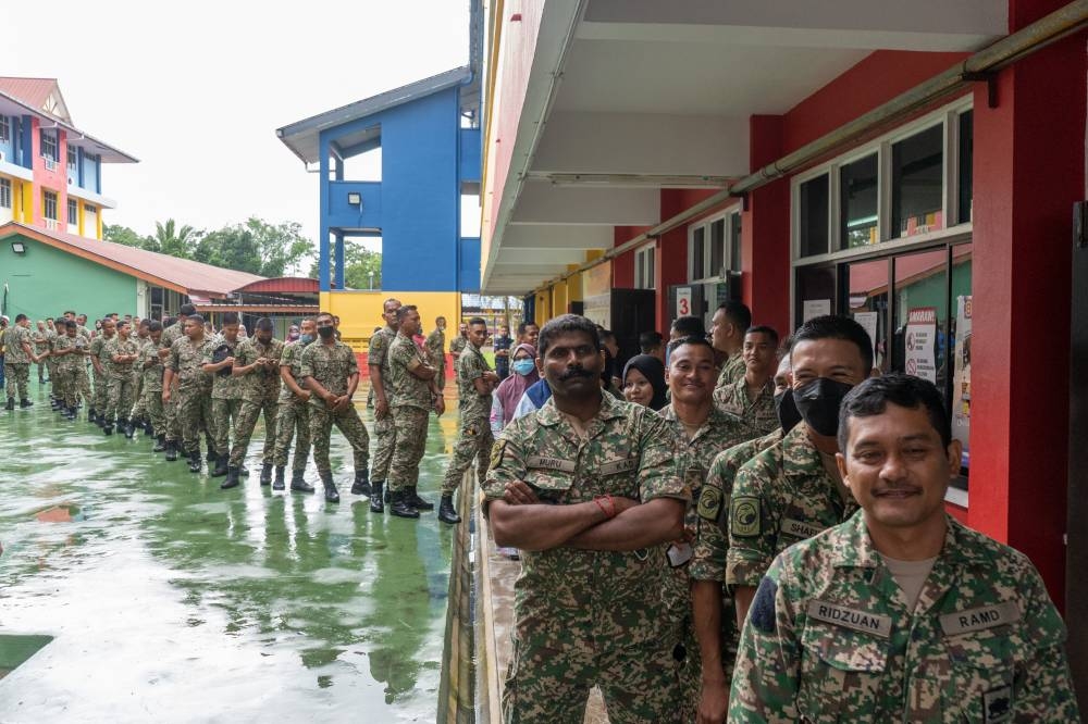 Army officers queue to cast their ballots during early voting ahead of the 15th general election at Kem Lapangan Terbang, Sungai Petani, Kedah, November 15, 2022. — Picture by Shafwan Zaidon