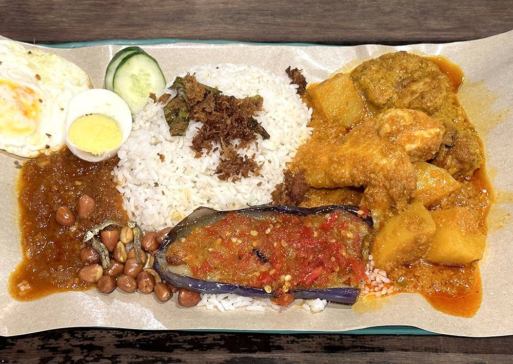 Fuel up with their 'nasi lemak' paired with 'kapitan chicken', 'pork rendang' and brinjal.