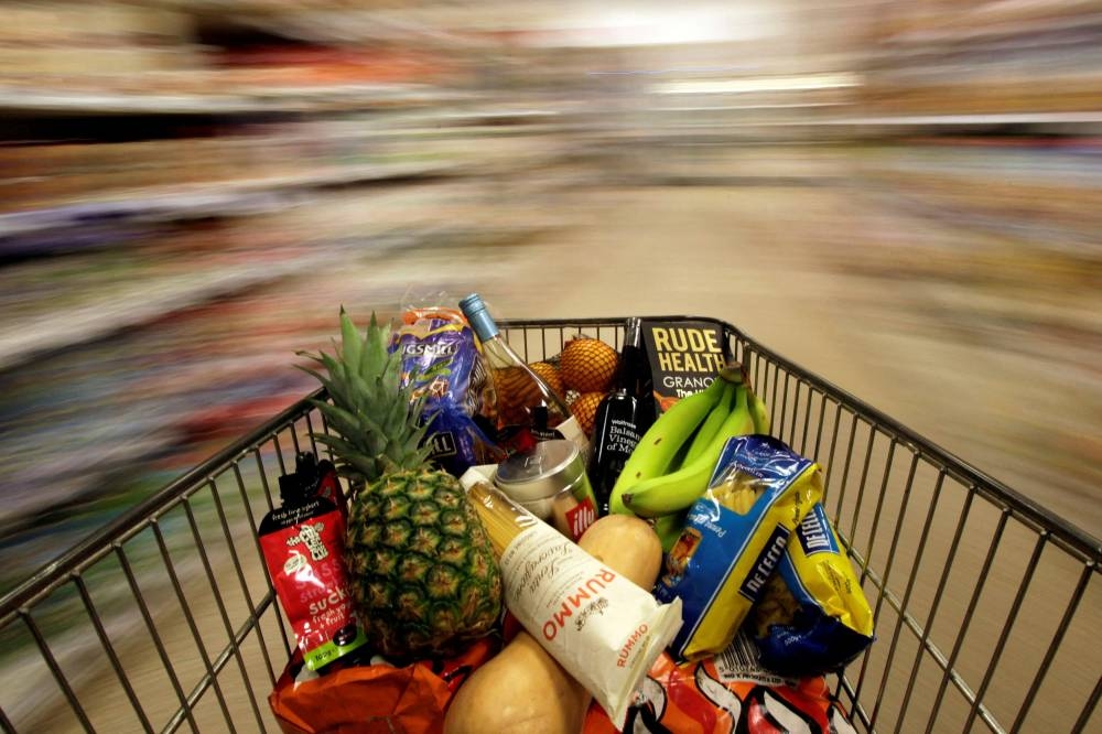 A shopping trolley is pushed around a supermarket in London May 19, 2015. — Reuters pic