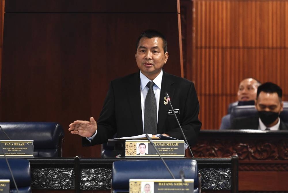 Datuk Seri Ikmal Hisham Abdul Aziz speaks at Dewan Rakyat August 2, 2022. — Bernama pic