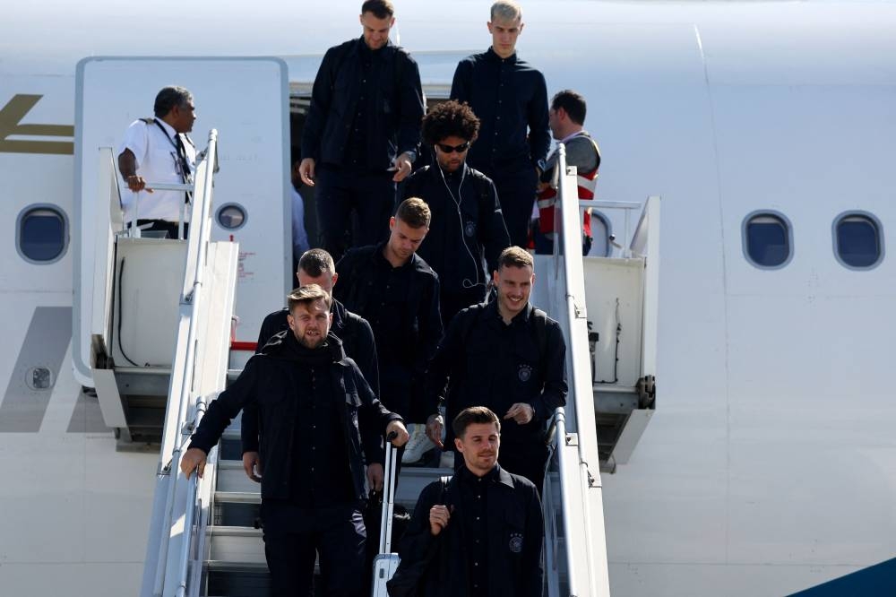 Germany’s Serge Gnabry, Manuel Neuer and Joshua Kimmich arrive ahead of the Fifa World Cup Qatar 2022 at the Hamad International Airport, Doha, Qatar, November 17, 2022. — Reuters pic 