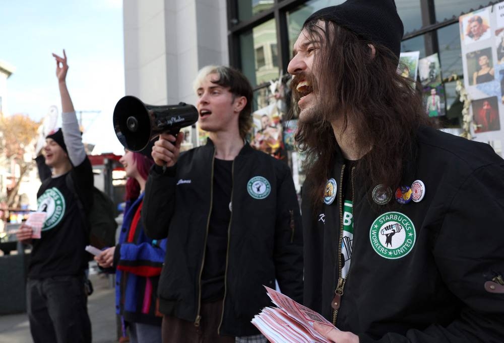 Striking Starbucks workers chant outside of a Starbucks coffee shop during a national strike in San Francisco November 17, 2022.— AFP pic 