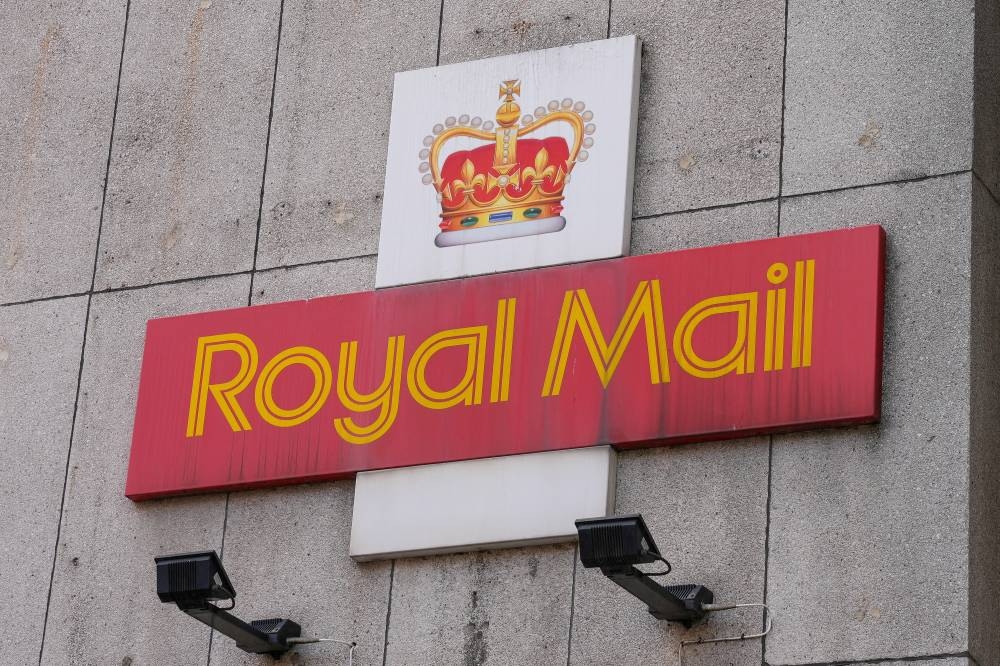 A Royal Mail sign is pictured outside a post delivery office, in London August 26, 2022. — Reuters