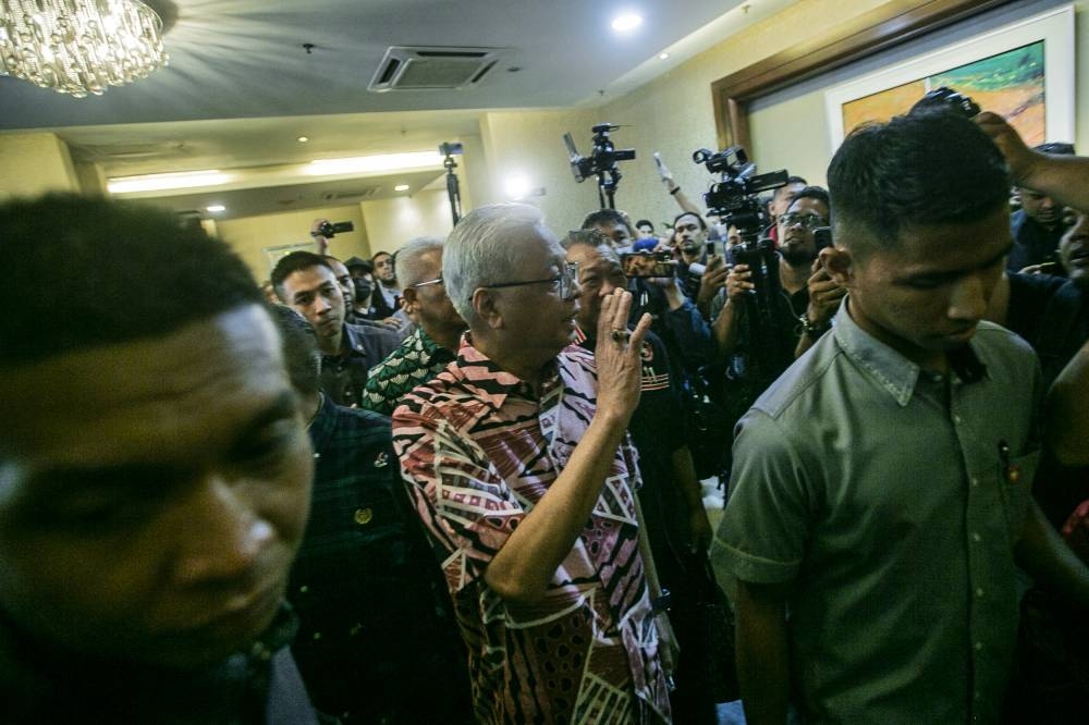 Caretaker prime minister Datuk Seri Ismail Sabri Yaakob (center) at the press conference in Seri Pacific Hotel in Kuala Lumpur November 21, 2022. — Picture by Hari Anggara  