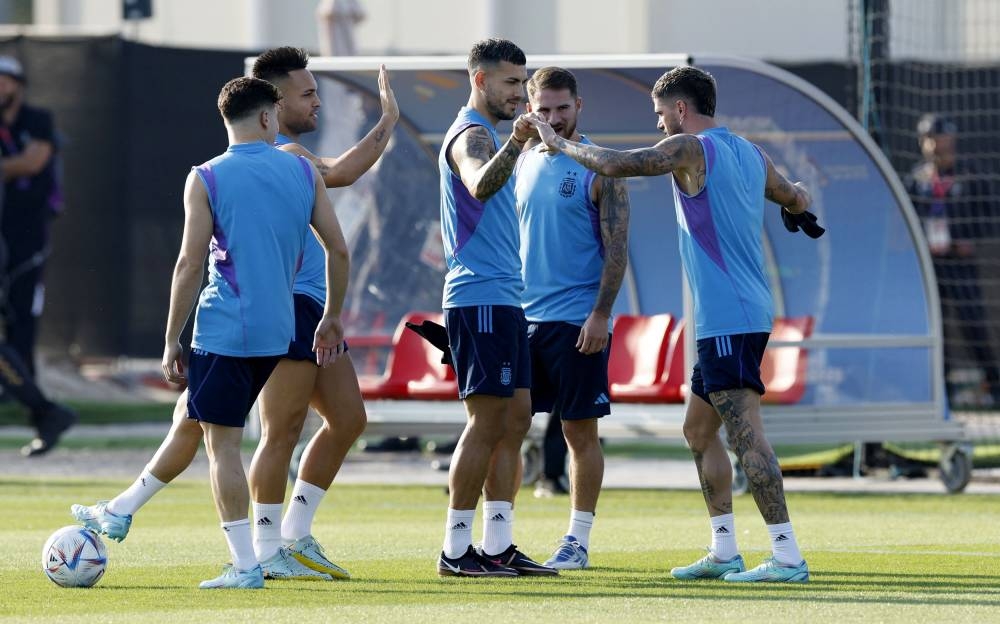 Argentina’s Leandro Paredes and Lautaro Martinez with teammates during training at Qatar University Training Site 3, Doha, Qatar, November 21, 2022. — Reuters pic 