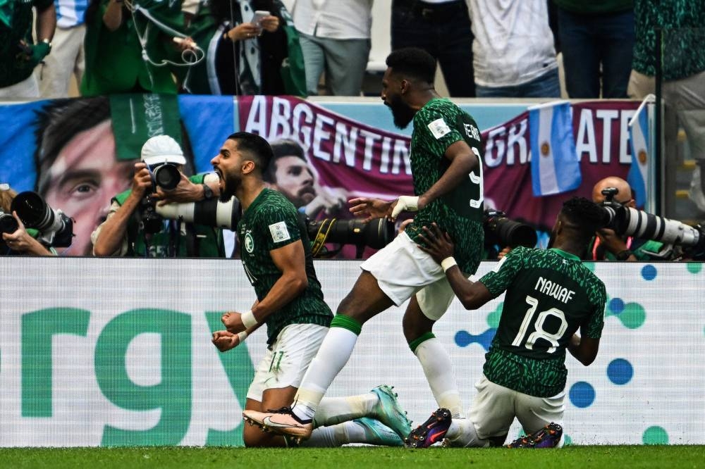 Saudi Arabia’s forward #11 Saleh Al-Shehri (left) celebrates with teammates after scoring his team’s first goal during the Qatar 2022 World Cup Group C match between Argentina and Saudi Arabia at the Lusail Stadium in Lusail, north of Doha, November 22, 2022. — AFP pic 