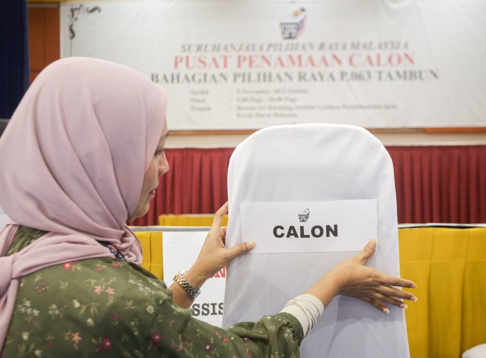 An Election Commission personnel makes final preparations at a nomination centre in Tambun November 4, 2022. — Picture by Farhan Najib