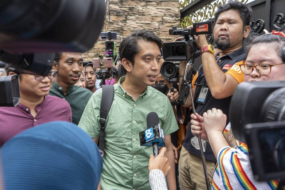 PKR Youth chief  Adam Adli speaks to reporters in front Datuk Seri Anwar Ibrahim's office in Petaling Jaya November 23, 2022. — Picture by Shafwan Zaidon