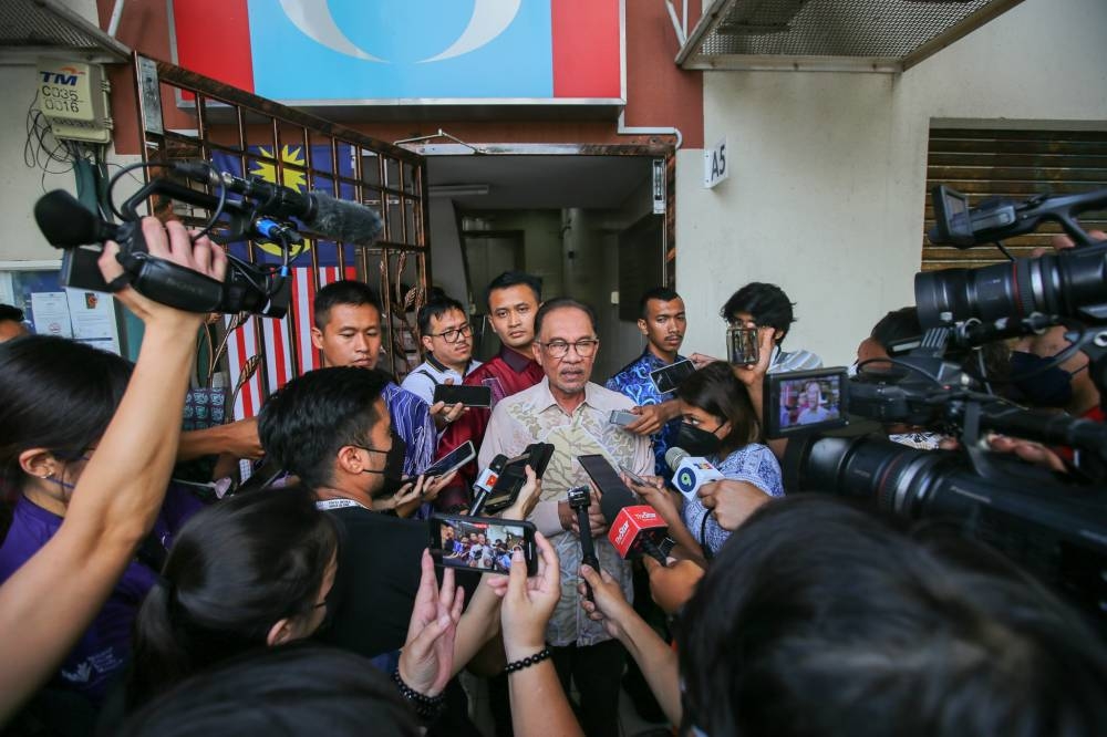 Prime Minister and Pakatan Harapan chairman Datuk Seri Anwar Ibrahim speaks to the media after chairing a PH presidential council meeting at its headquarters in Petaling Jaya, November 28,2022. — Picture by Ahmad Zamzahuri