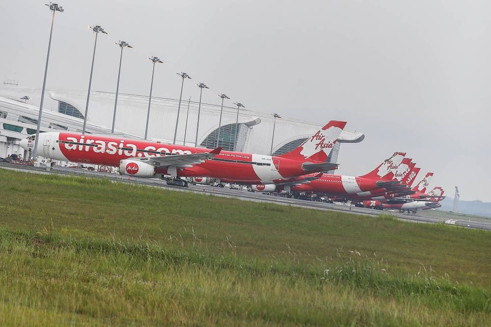 Airasia planes are seen at the  Kuala Lumpur International Airport (KLIA) in Sepang September 21, 2022. — Picture by Sayuti Zainudin