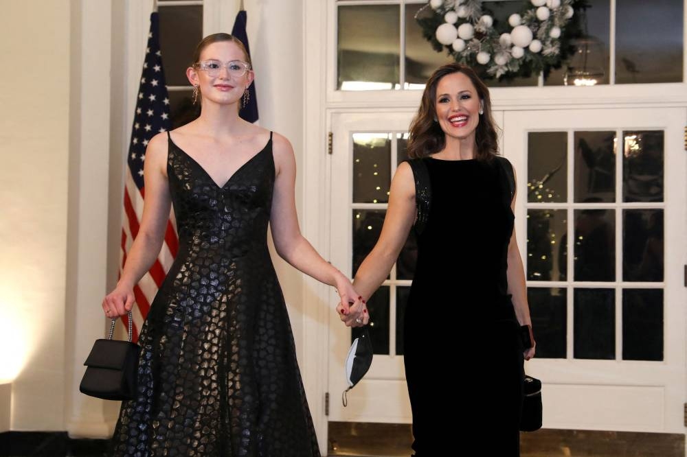 Jennifer Garner and her daughter Violet Affleck arrive for a state dinner in honour of French President Emmanuel Macron at the White House in Washington December 1, 2022. — Reuters pic