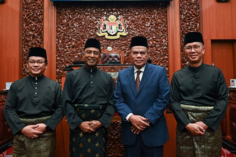 (From left) Datuk Mohd Na'im Mokhtar, Datuk Seri Zambry Abdul Kadir, Datuk Seri Saifuddin Nasution Ismail and Datuk Seri Tengku Zafrul Abdul Aziz during the swearing in ceremony at Istana Negara, December 3, 2022. ― Picture courtesy of Information Department Malaysia