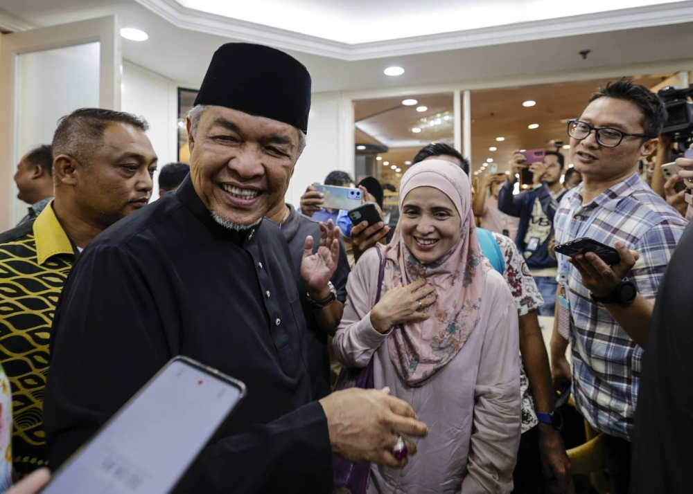 Barisan Nasional Chairman Datuk Seri Dr Ahmad Zahid Hamidi (left) as he leaves the World Trade Center (WTC) after attending a meeting of Umno Divisional Leaders, November 24, 2022. — Bernama pic