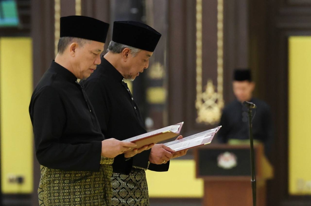 Barisan Nasional (BN) Chairman Datuk Seri Dr Ahmad Zahid Hamidi and Parti Pesaka Bumiputera Bersatu (PBB) Senior Vice President Datuk Seri Fadillah Yusof were sworn in as Deputy Prime Ministers before the Yang di-Pertuan Agong Al- Sultan Abdullah Ri'ayatuddin Al-Mustafa Billah Shah at Istana Negara December 3, 2022. Ahmad Zahid also holds the portfolio of Minister of Rural and Regional Development while Fadillah is the Minister of Plantation and Commodities. — Bernama pic