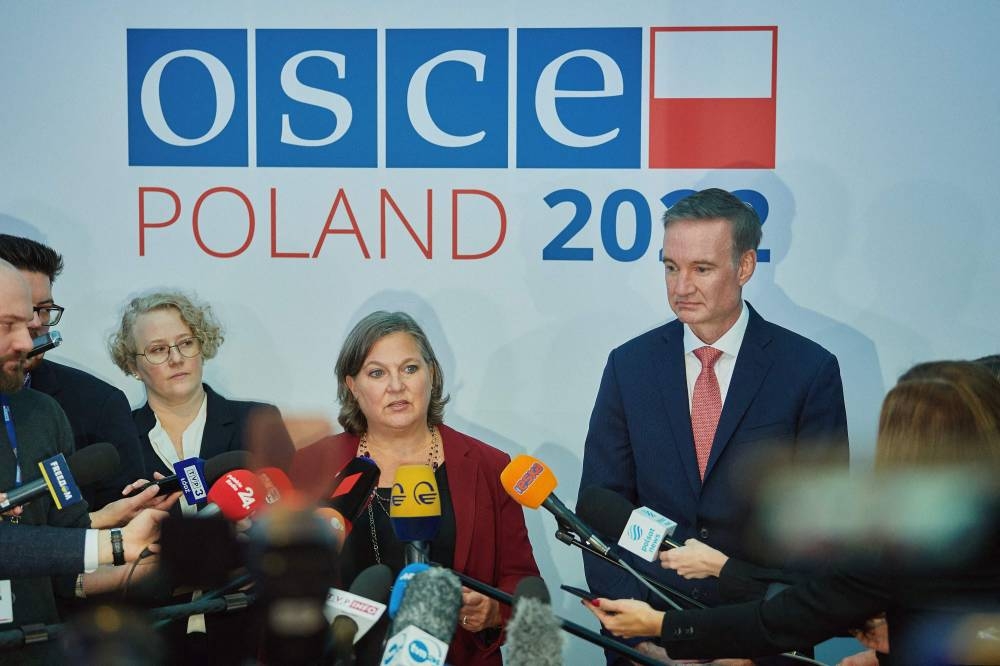 US Under Secretary of State for Political Affairs Victoria Nuland (centre) speaks with journalists as she attends the 29th Ministerial Council meeting of the OSCE (Organisation for Security and Co-operation in Europe) in Lodz, Poland on December 1, 2022. — AFP pic