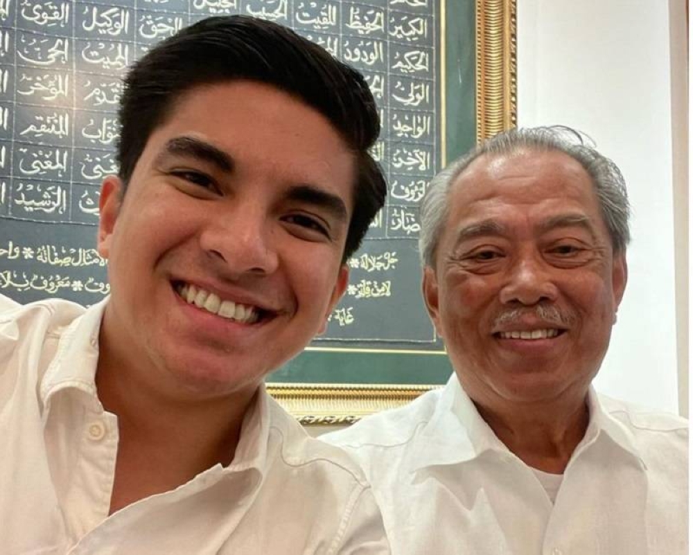 Muda president Syed Saddiq Abdul Rahman (left) shared a picture of himself with PN chairman Tan Sri Muhyiddin Yassin in a Facebook post today. — Picture via Facabook/ Syed Saddiq Abdul Rahman