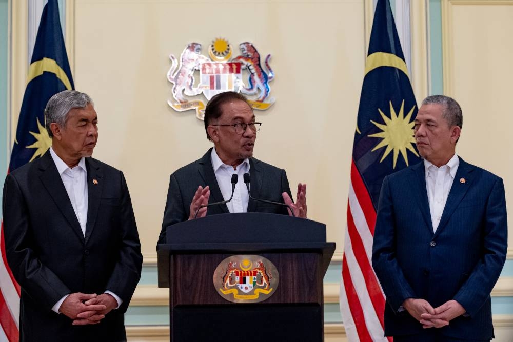 Prime Minister Datuk Seri Anwar Ibrahim speaks at a press conference after chairing the first special Cabinet meeting in Putrajaya, December 5, 2022. — Picture courtesy of Afiq Hambali/Prime Minister’s Office of Malaysia