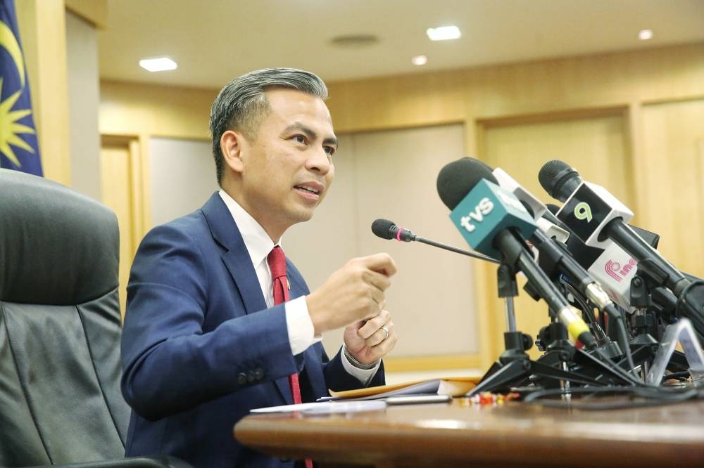 Communications Minister Fahmi Fadzil speaks during a press conference in Putrajaya December 7, 2022. — Picture by Choo Choy May