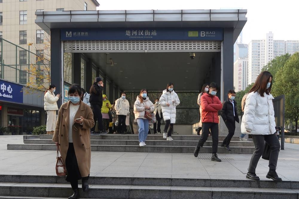 People walk out of a subway station during morning rush hour in Wuchang district, after the government gradually loosened the restrictions on coronavirus disease (COVID-19) control, in Wuhan, Hubei province, China December 9, 2022. — Reuters pic