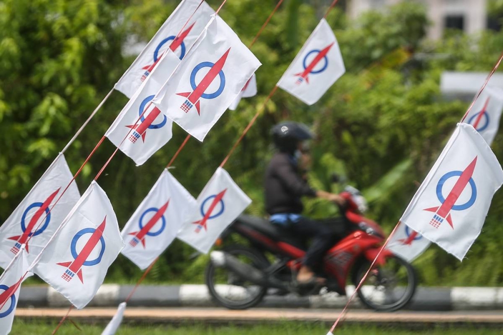 DAP flags are pictured in Kuching December 15, 2021. — Picture by Yusof Mat Isa