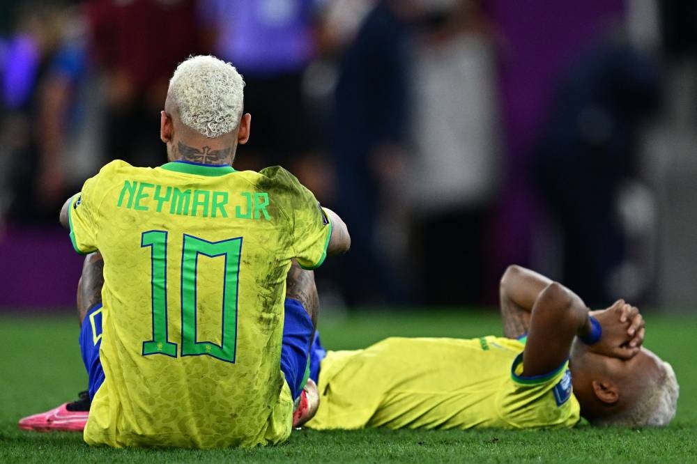 Brazil’s forward #10 Neymar and Brazil’s forward #21 Rodrygo react after losing in the penalty shoot-out after extra-time of the Qatar 2022 World Cup quarter-final football match between Croatia and Brazil at Education City Stadium in Al-Rayyan, west of Doha, on December 9, 2022. — AFP pic