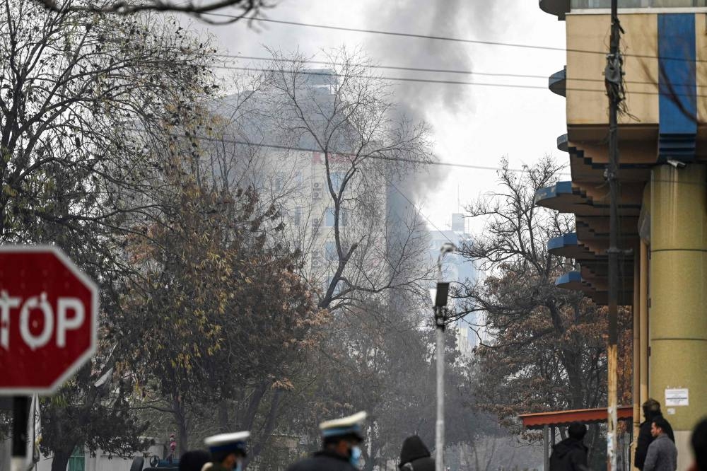 Smoke rises from a site of an attack at Shahr-e-naw which is city's one of main commercial areas in Kabul on December 12, 2022. — AFP pic