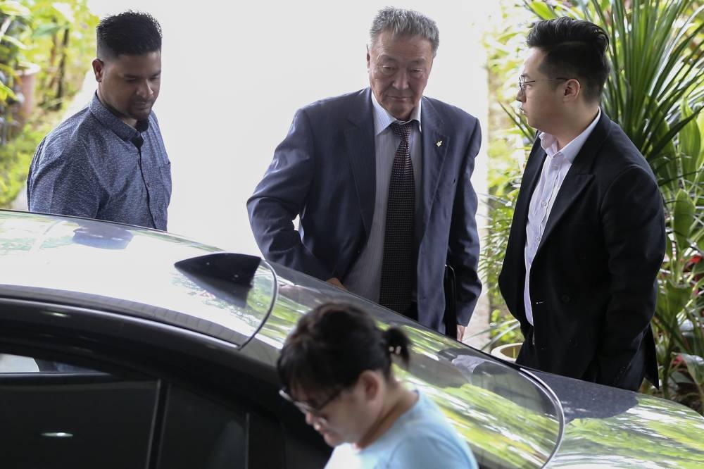 Dr Shaariibuu Setev (centre) and Altantuya's son, Munhgunshagi Bayarjargal (right) arrives at Shah Alam Hight Court January 30, 2019. — Picture by Yusof Mat Isa