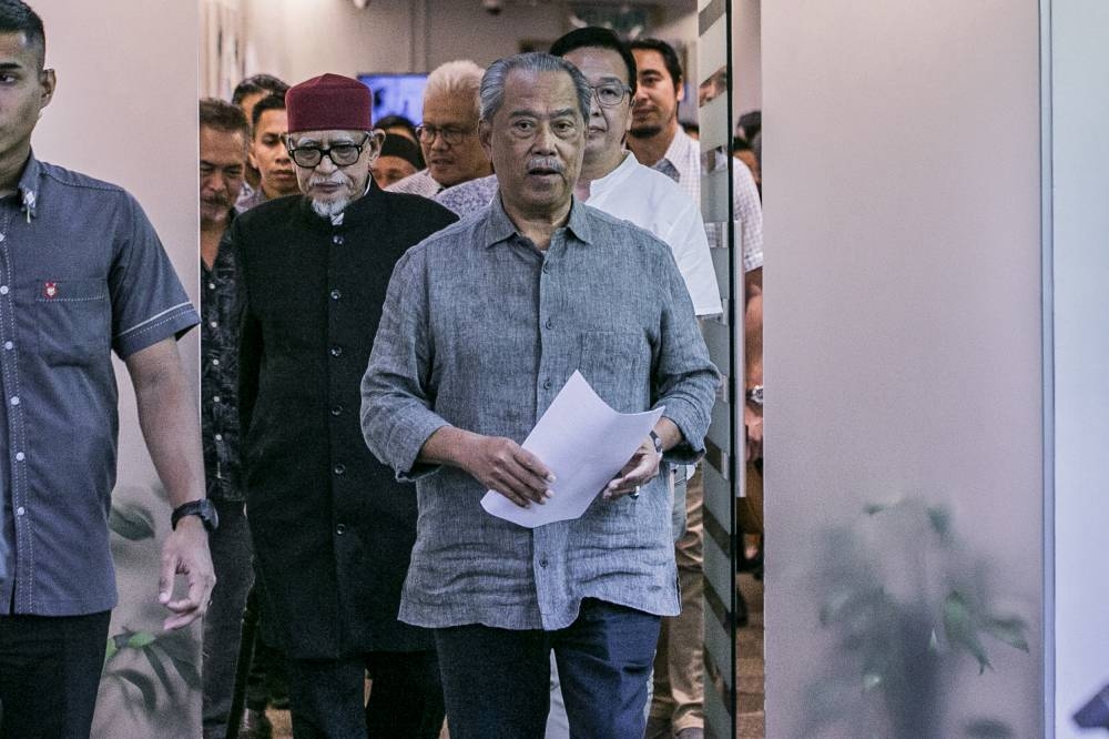 File picture shows PN chairman Tan Sri Muhyiddin Yassin arriving at PN headquarter for the press conference at Publika November 24, 2022. — Picture by Hari Anggara