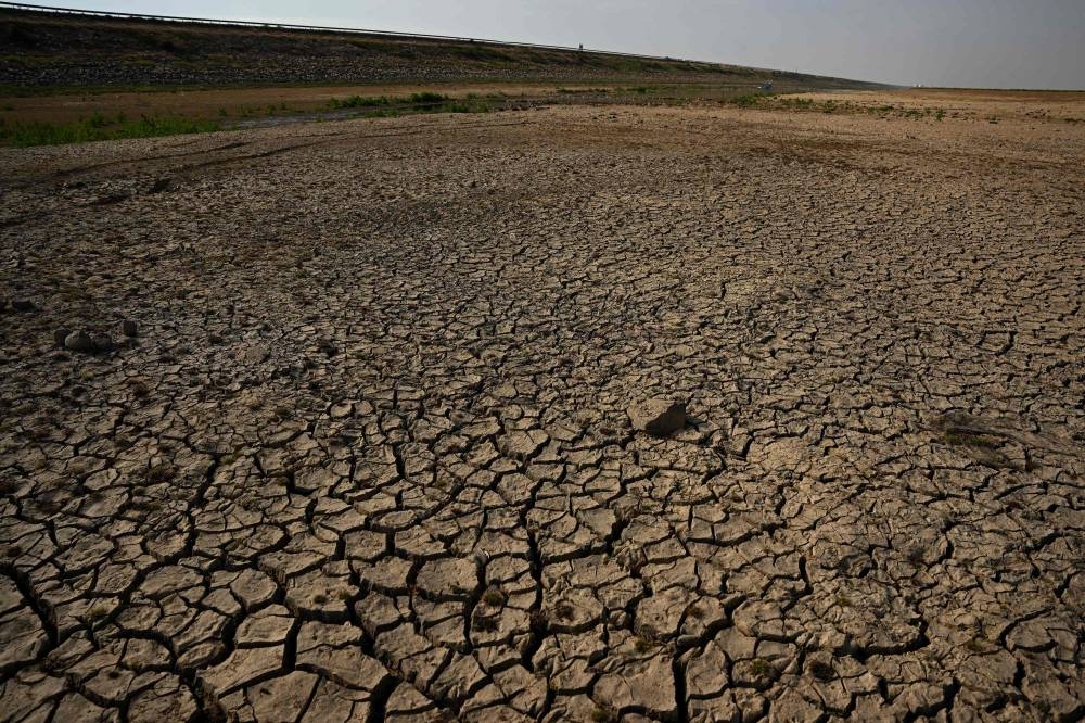 This photo taken on November 6, 2022, shows the dried-up freshwater Poyang Lake in Juijiang, China's central Jiangxi province. Spooked by a historic drought, local authorities in China have renewed controversial plans to dam the country's biggest freshwater lake, which is slowly recovering after shrinking to less than a third of its usual size. — AFP pic