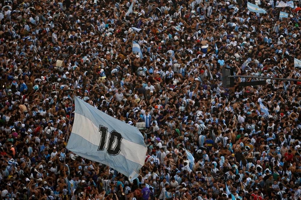 In this aerial view fans of Argentina celebrate winning the Qatar 2022 World Cup against France at the Obelisk  in Buenos Aires, on December 18, 2022. — AFP pic