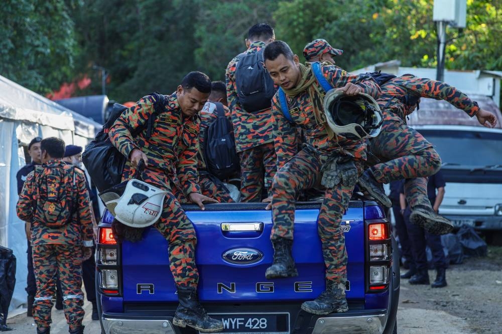 Fire and Rescue Department personnel arrive to search and rescue victims buried in the landslide tragedy at the Father’s Organic Farm campsite, December 20, 2022. — Bernama pic 